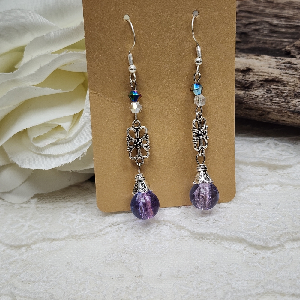 Hand Crafted Dangle Earrings With Silver Toned Accents and Purple Crackled Glass